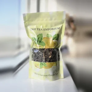 Mint & Lemon Green Tea resealable pouch with a clear window showing the loose leaf tea inside